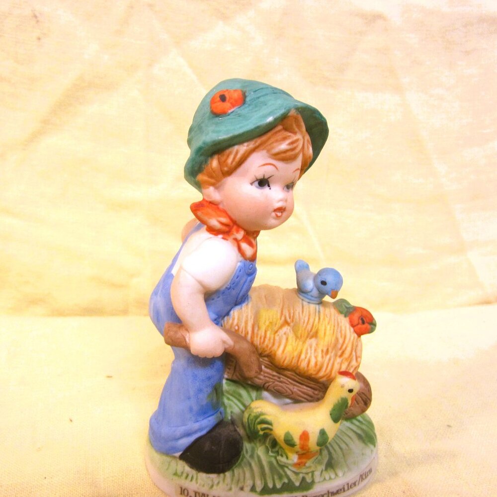 VTG 1992 HANDGEMALT PORCELAIN FIGURINE, BOY PUSHING WHEEL BARROW